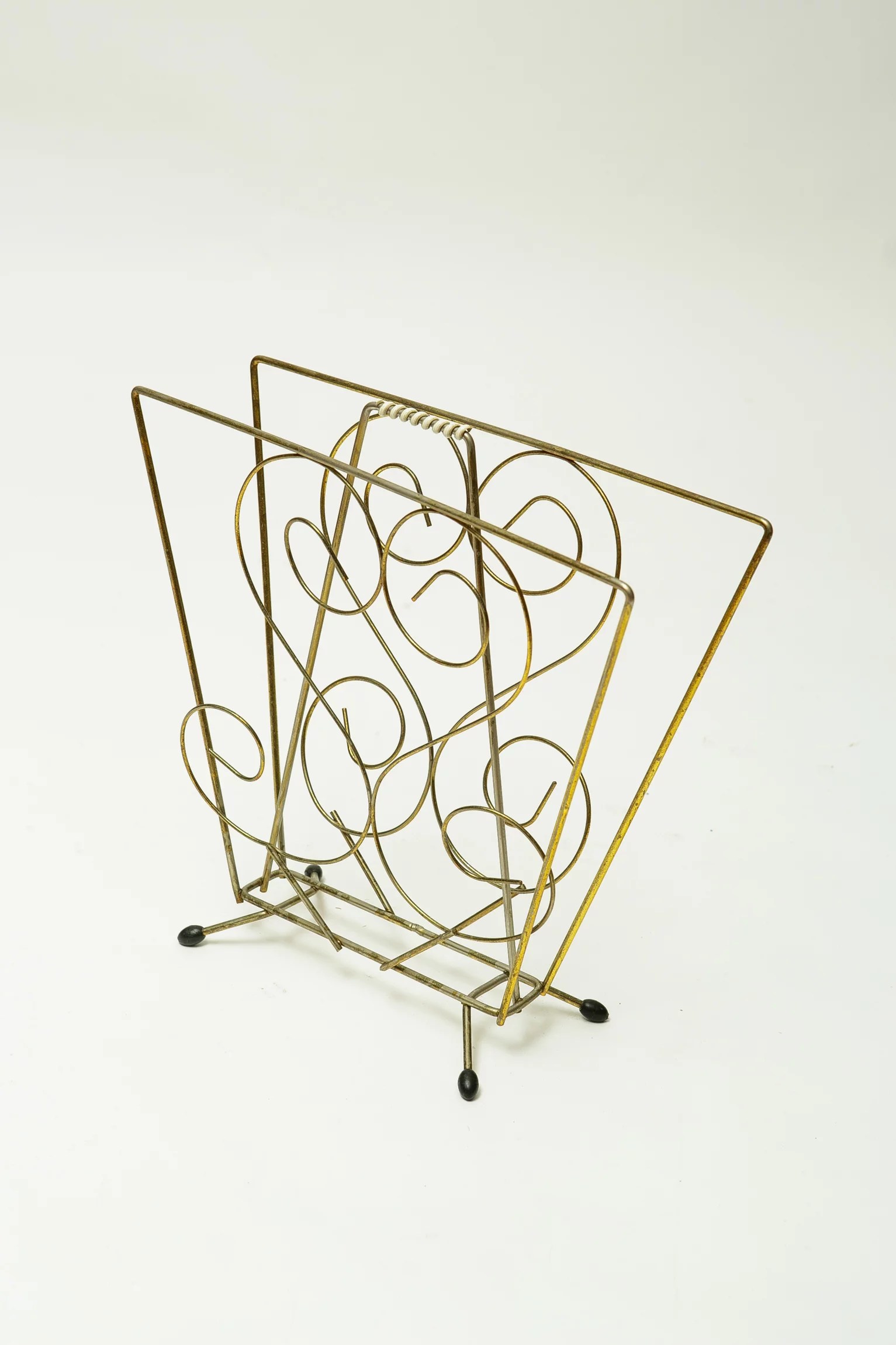 1960s kitsch brass magazine rack