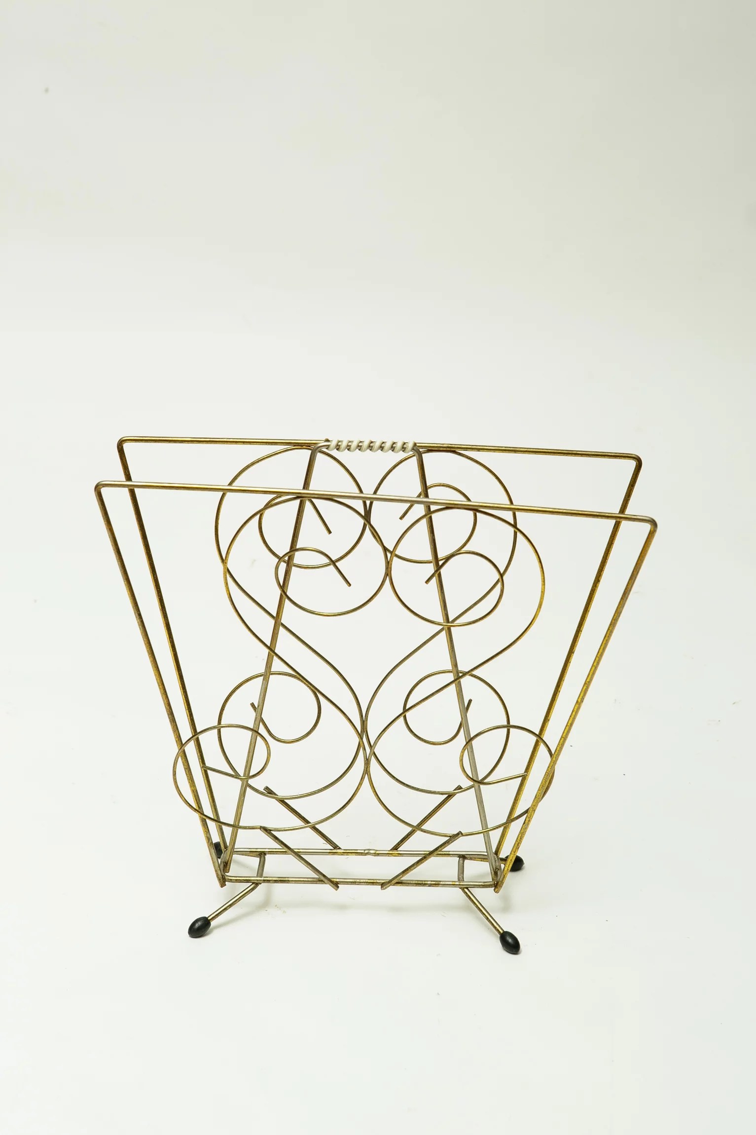 1960s kitsch brass magazine rack