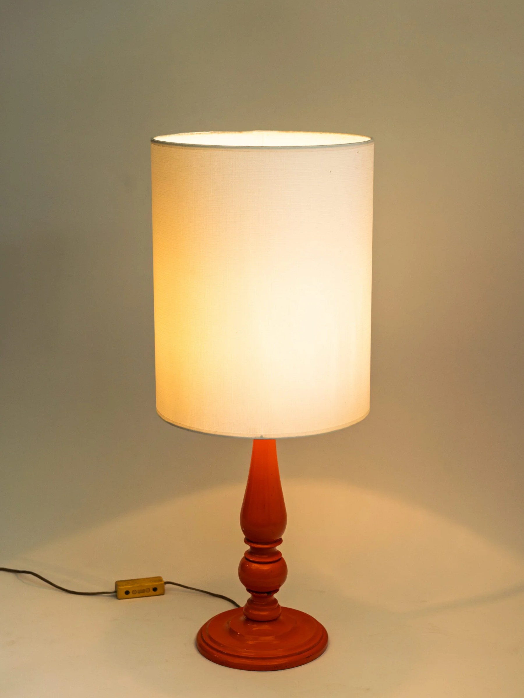 1970s MCM painted wood orange table lamp