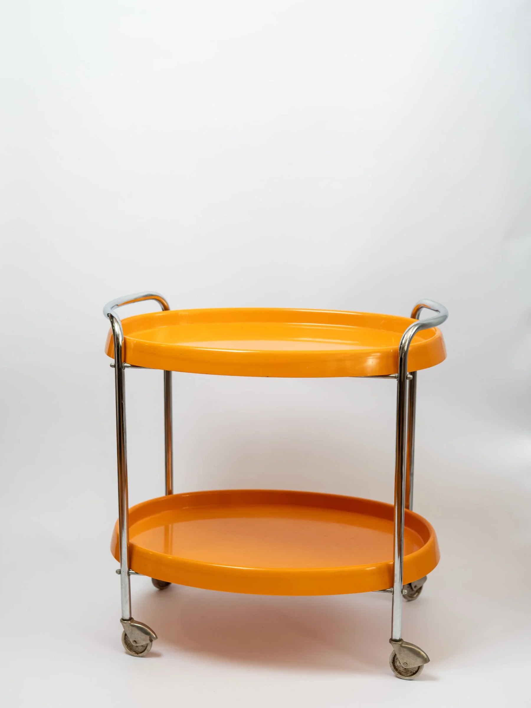 1970s space age MCM orange plastic & chrome drinks trolley