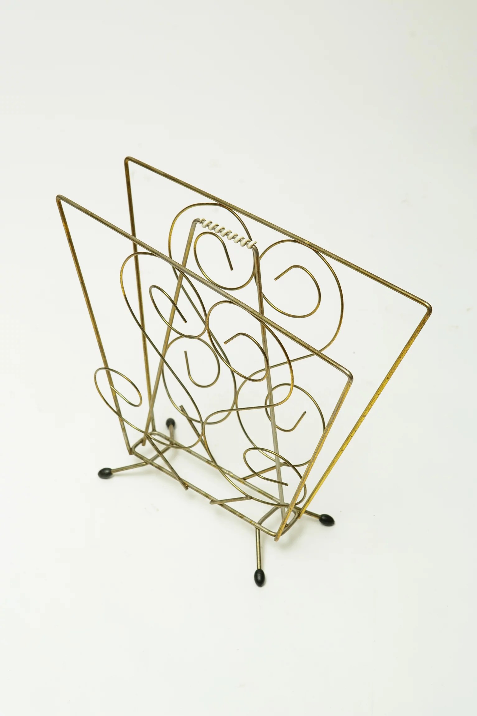 1960s kitsch brass magazine rack
